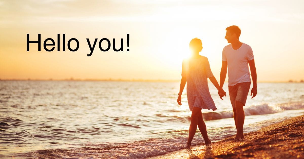 Happy couple walking on beach